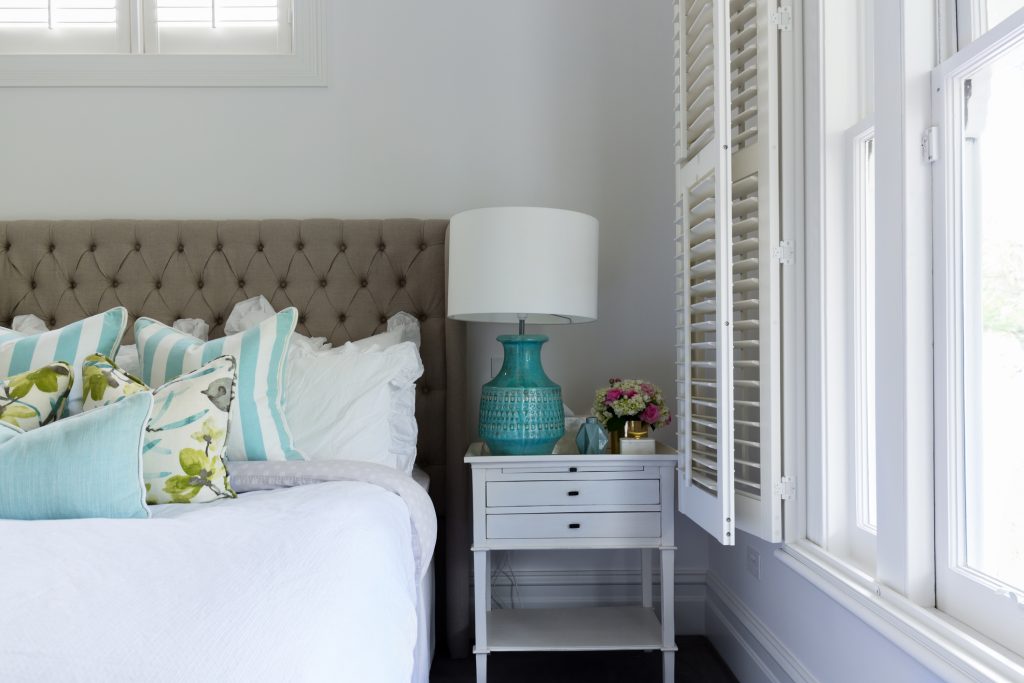 Sweet Dreams: A Guide to Refreshing Your Bedroom. Interior details of a master bedroom bedside table